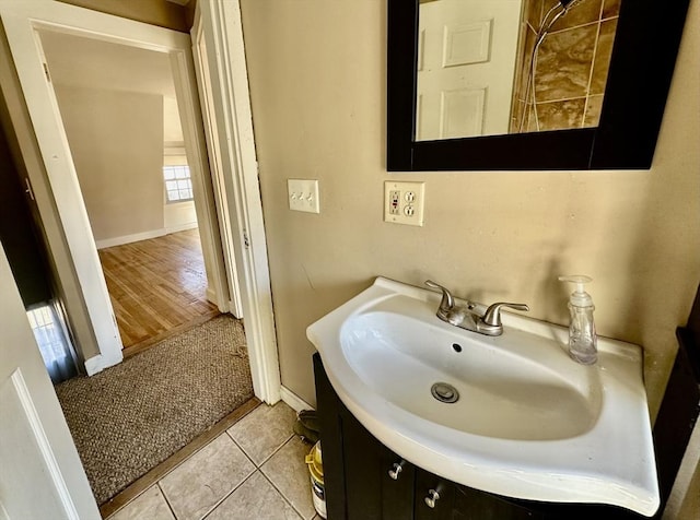 bathroom with tile patterned floors and vanity