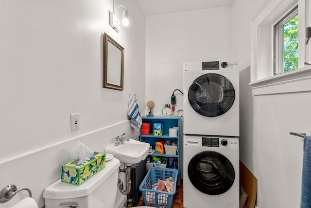 18 Milton Rd, Brookline, MA 02445 - washroom featuring estacked washer and dryer
