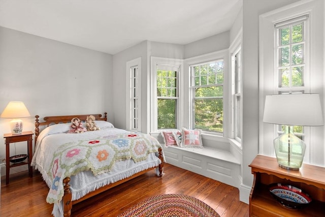 18 Milton Rd, Brookline, MA 02445 - bedroom featuring wood-type flooring and multiple windows