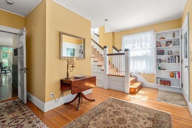 18 Milton Rd, Brookline, MA 02445 - entryway with stairs, wood finished floors, ornamental molding, and baseboards