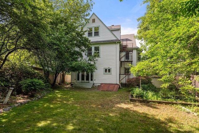 18 Milton Rd, Brookline, MA 02445 - rear view of house featuring a balcony