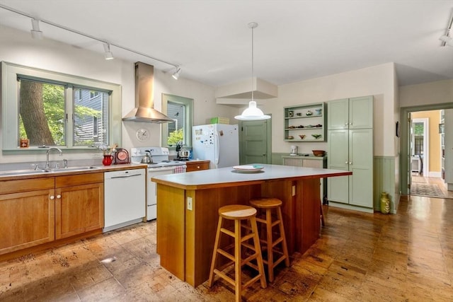 18 Milton Rd, Brookline, MA 02445 - kitchen featuring white appliances, wall chimney range hood, track lighting, and a sink