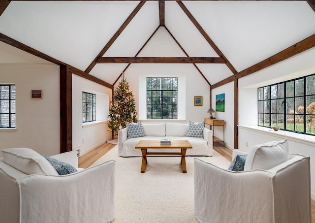 living room featuring lofted ceiling with beams