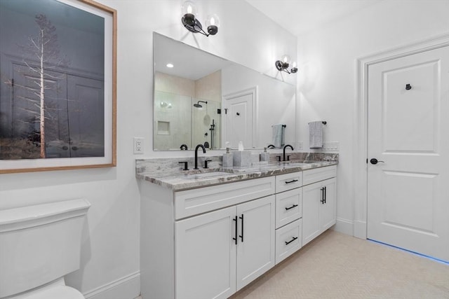 4 Pioneer Rd Unit 4, Framingham, MA 01701 - bathroom featuring a shower stall, double vanity, toilet, and baseboards