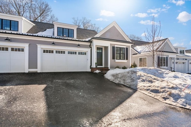 4 Pioneer Rd Unit 4, Framingham, MA 01701 - view of front of house with asphalt driveway and a garage