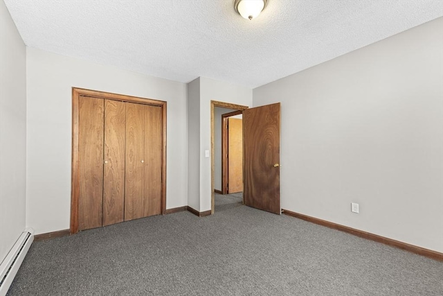 unfurnished bedroom featuring carpet floors, a baseboard radiator, a textured ceiling, and a closet