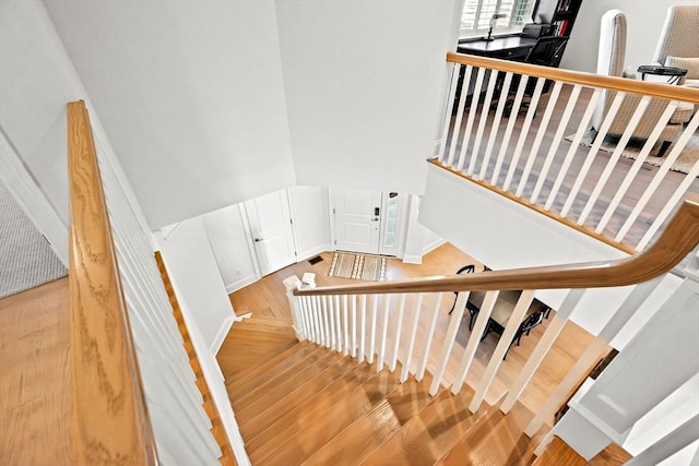 stairway featuring wood finished floors