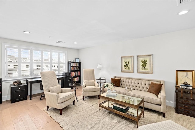 living room featuring visible vents, recessed lighting, baseboards, and wood finished floors