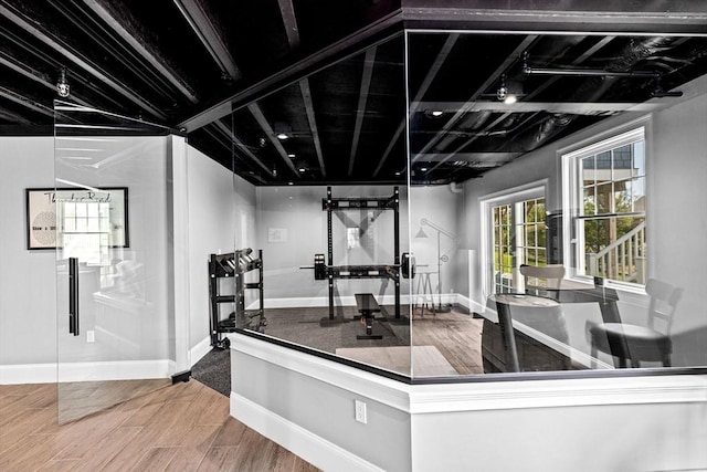 interior space featuring baseboards and wood finished floors