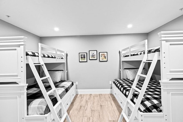 bedroom featuring baseboards, recessed lighting, and light wood-style flooring