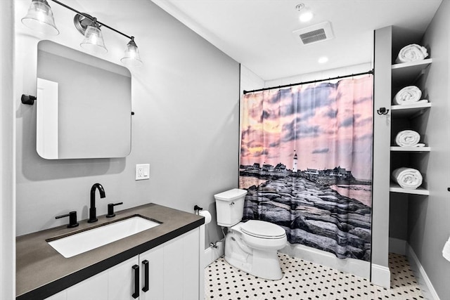 full bathroom with visible vents, baseboards, toilet, and vanity