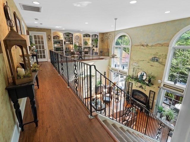 101 Colonial Dr Unit 101, Sturbridge, MA 01566 - hallway with an upstairs landing, wood finished floors, healthy amount of natural light, and recessed lighting