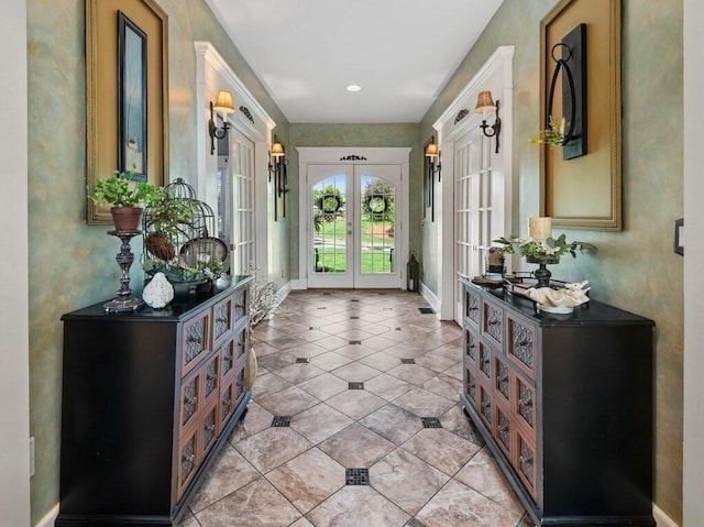 101 Colonial Dr Unit 101, Sturbridge, MA 01566 - doorway to outside with french doors, baseboards, and light tile patterned floors