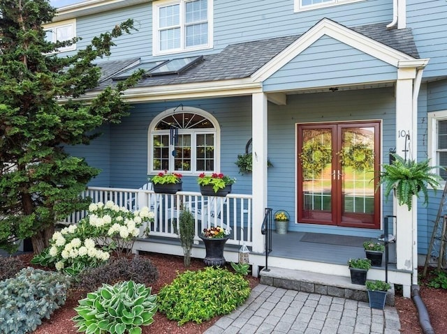 101 Colonial Dr Unit 101, Sturbridge, MA 01566 - doorway to property featuring covered porch, french doors, and roof with shingles