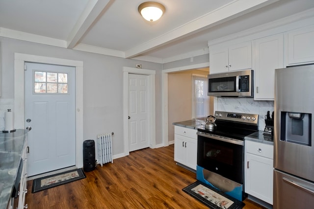 kitchen with radiator, stainless steel appliances, beamed ceiling, dark hardwood / wood-style floors, and white cabinets