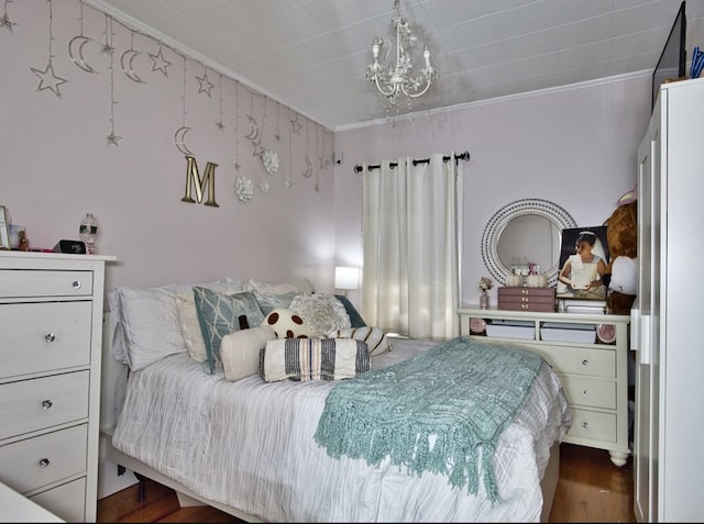 bedroom with ornamental molding, dark hardwood / wood-style flooring, and a chandelier