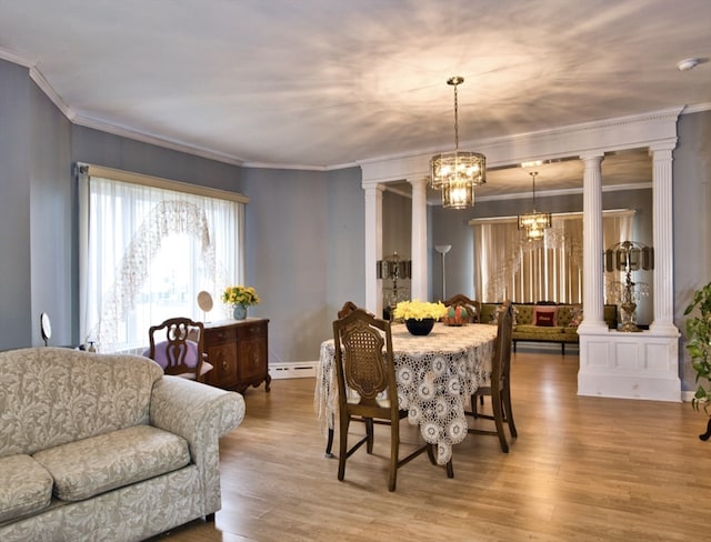 dining area with a chandelier, crown molding, light hardwood / wood-style floors, and decorative columns