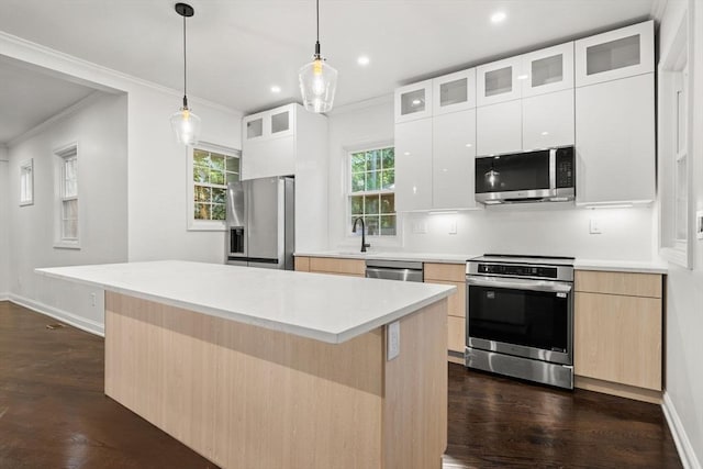 21 Greystone Rd Unit 2, Malden, MA 02148 - kitchen featuring appliances with stainless steel finishes, crown molding, dark wood-style flooring, light brown cabinetry, and recessed lighting