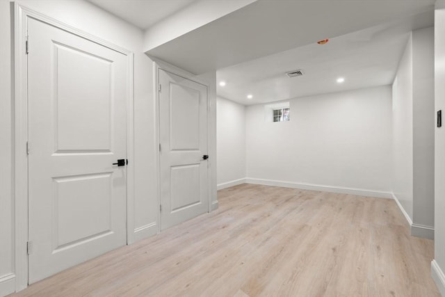 21 Greystone Rd Unit 2, Malden, MA 02148 - below grade area featuring light wood finished floors and recessed lighting