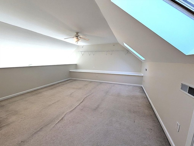 additional living space featuring carpet floors, vaulted ceiling, ceiling fan, and baseboards