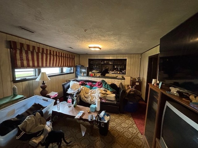 10 Gloversbrook Rd, Randolph, MA 02368 - living room featuring wood walls and a textured ceiling