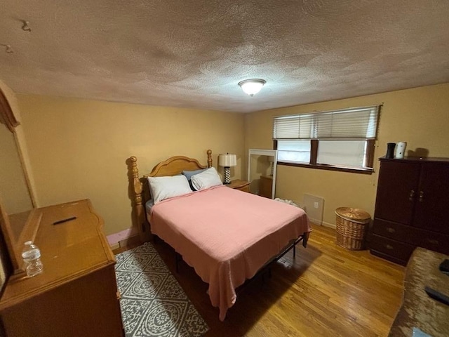 10 Gloversbrook Rd, Randolph, MA 02368 - bedroom featuring a textured ceiling and light wood-style flooring
