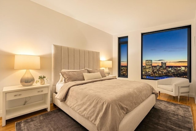 bedroom with hardwood / wood-style flooring