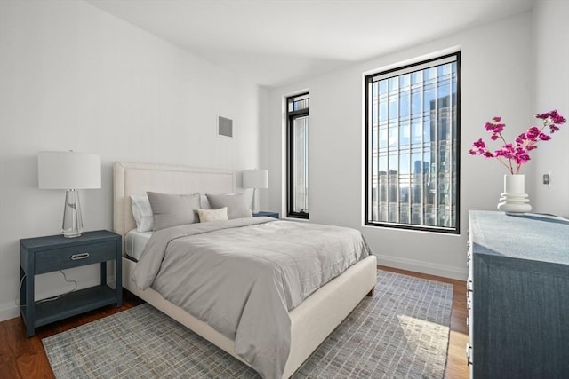 bedroom featuring dark hardwood / wood-style flooring