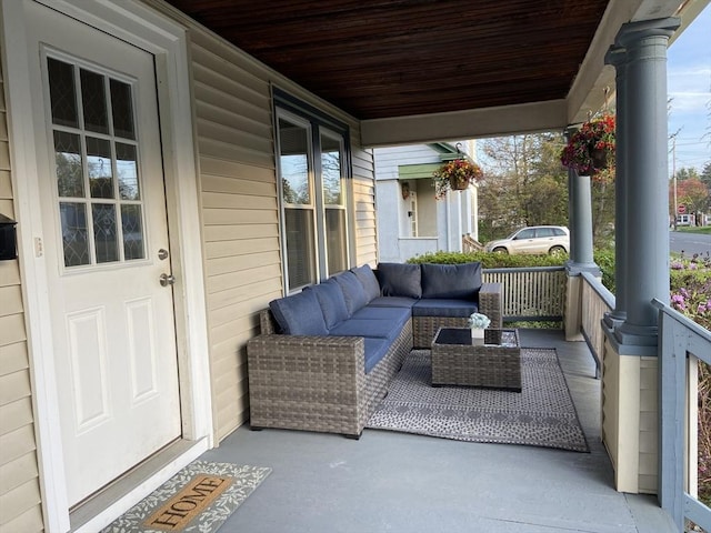 view of patio with a porch and an outdoor living space