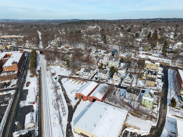 snowy aerial view with a residential view