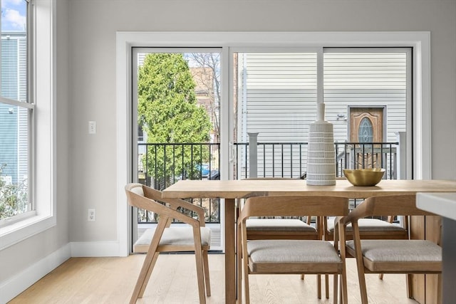 220 Bowen St Unit 2, Boston, MA 02127 - dining room with baseboards, healthy amount of natural light, and light wood-style floors