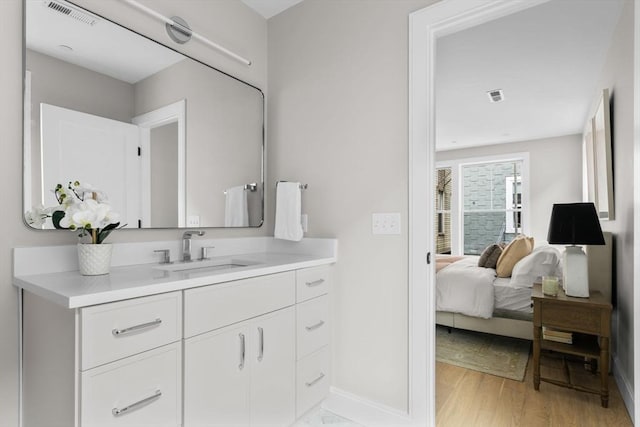 220 Bowen St Unit 2, Boston, MA 02127 - bathroom featuring vanity, baseboards, and wood finished floors