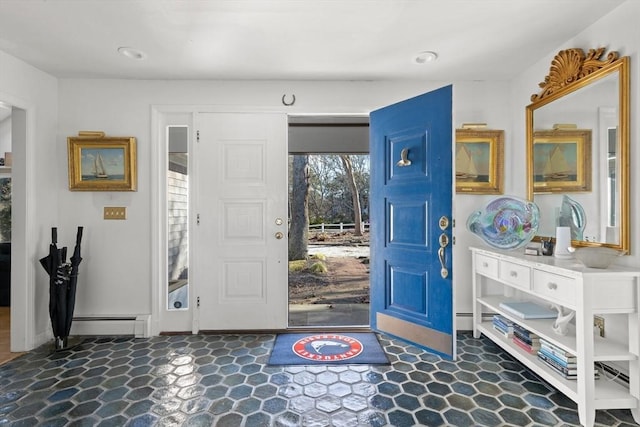 foyer entrance with tile patterned floors and a baseboard radiator