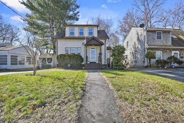 bungalow with a front lawn