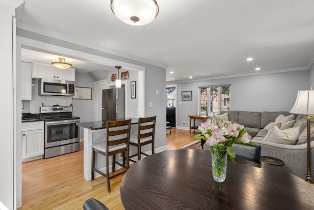 106 Pierce Rd Unit 106, Watertown, MA 02472 - dining space featuring light wood-type flooring, ornamental molding, and recessed lighting
