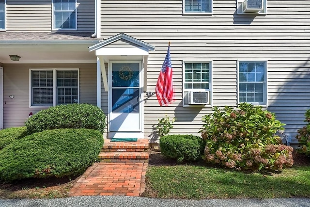 doorway to property with cooling unit