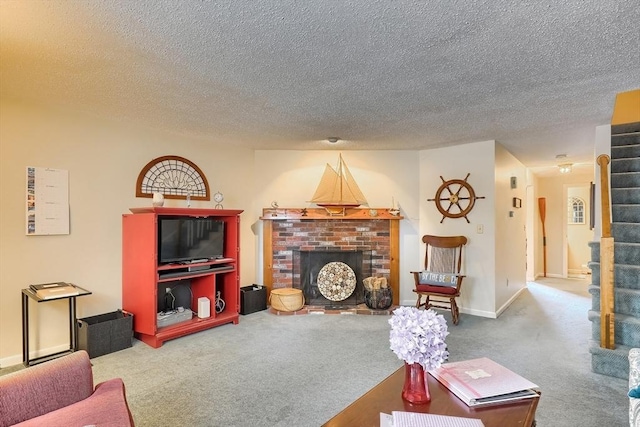 living room with carpet floors, a textured ceiling, and a fireplace