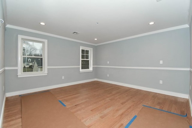 unfurnished room with wood finished floors and baseboards