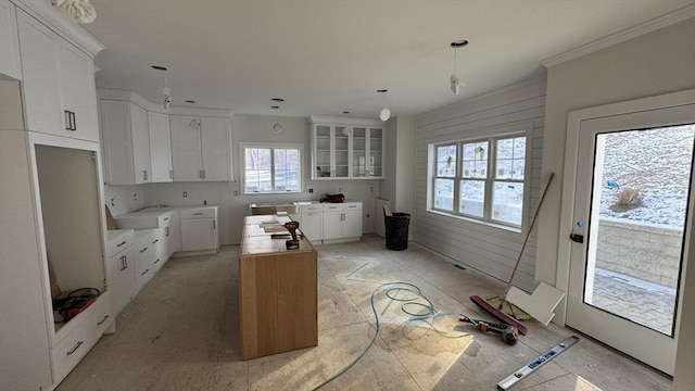 kitchen featuring glass insert cabinets and white cabinets