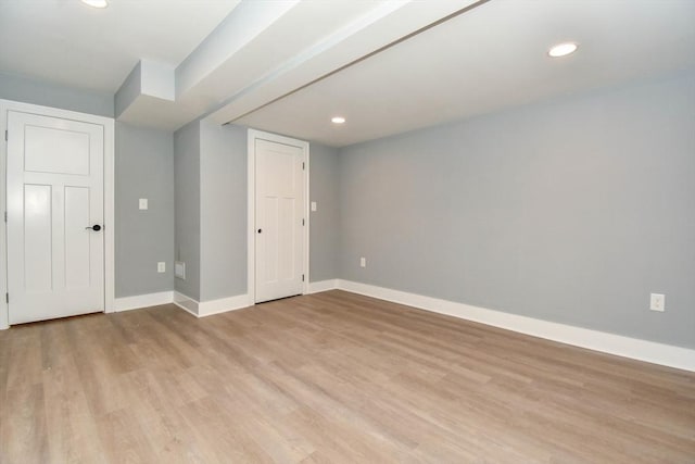 interior space featuring baseboards, recessed lighting, and light wood-style floors