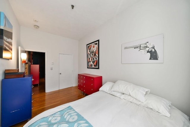 bedroom with wood finished floors