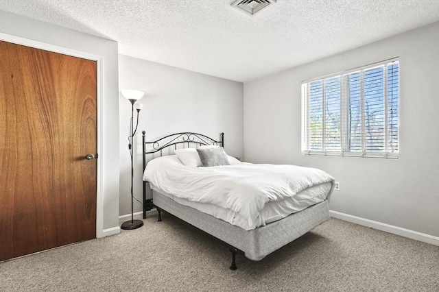 35 Prospect St Unit 313, Woburn, MA 01801 - carpeted bedroom with a textured ceiling and baseboards