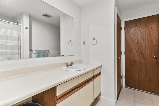 35 Prospect St Unit 313, Woburn, MA 01801 - full bath featuring vanity, tile patterned floors, and baseboards