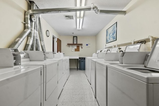 35 Prospect St Unit 313, Woburn, MA 01801 - shared laundry with washing machine and clothes dryer and a textured ceiling