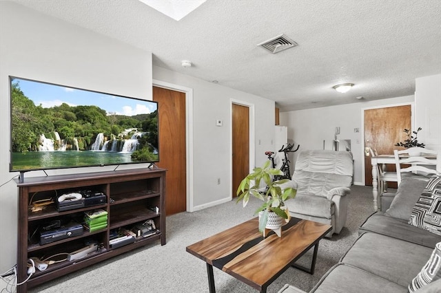 35 Prospect St Unit 313, Woburn, MA 01801 - carpeted living room with a textured ceiling and baseboards