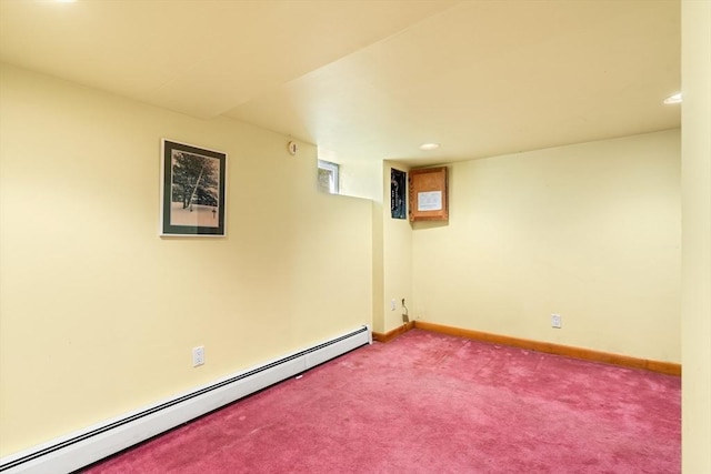 finished below grade area featuring carpet, recessed lighting, baseboard heating, and baseboards