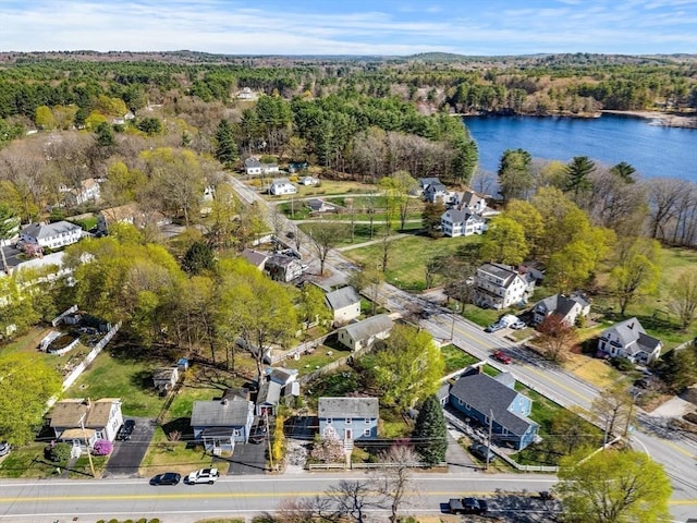 aerial view featuring a water view and a view of trees