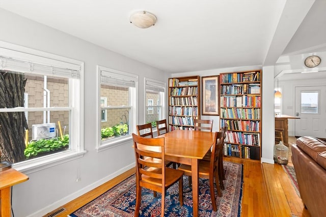 50 Walnut St, Northampton, MA 01060 - dining area featuring wood finished floors, baseboards, and cooling unit