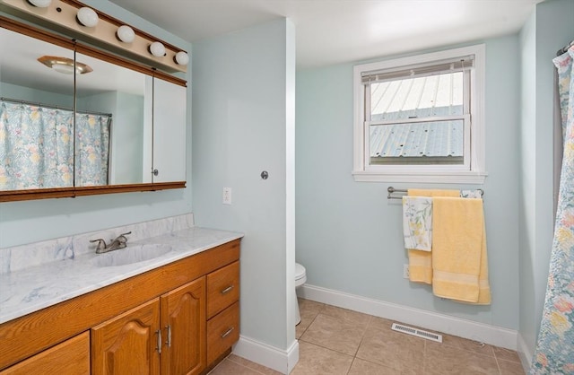 50 Walnut St, Northampton, MA 01060 - bathroom with baseboards, tile patterned floors, vanity, and toilet