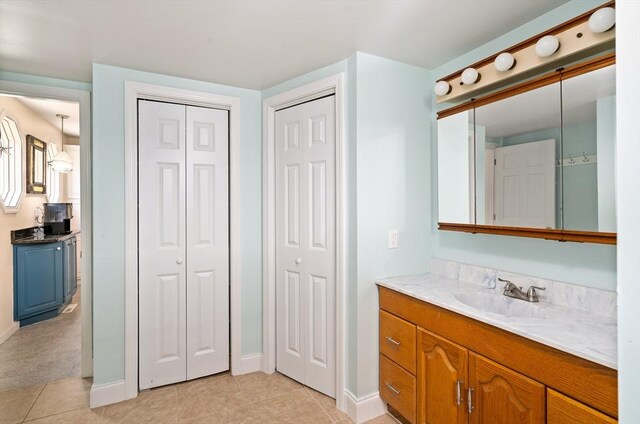 50 Walnut St, Northampton, MA 01060 - bathroom featuring a closet, vanity, tile patterned flooring, and baseboards